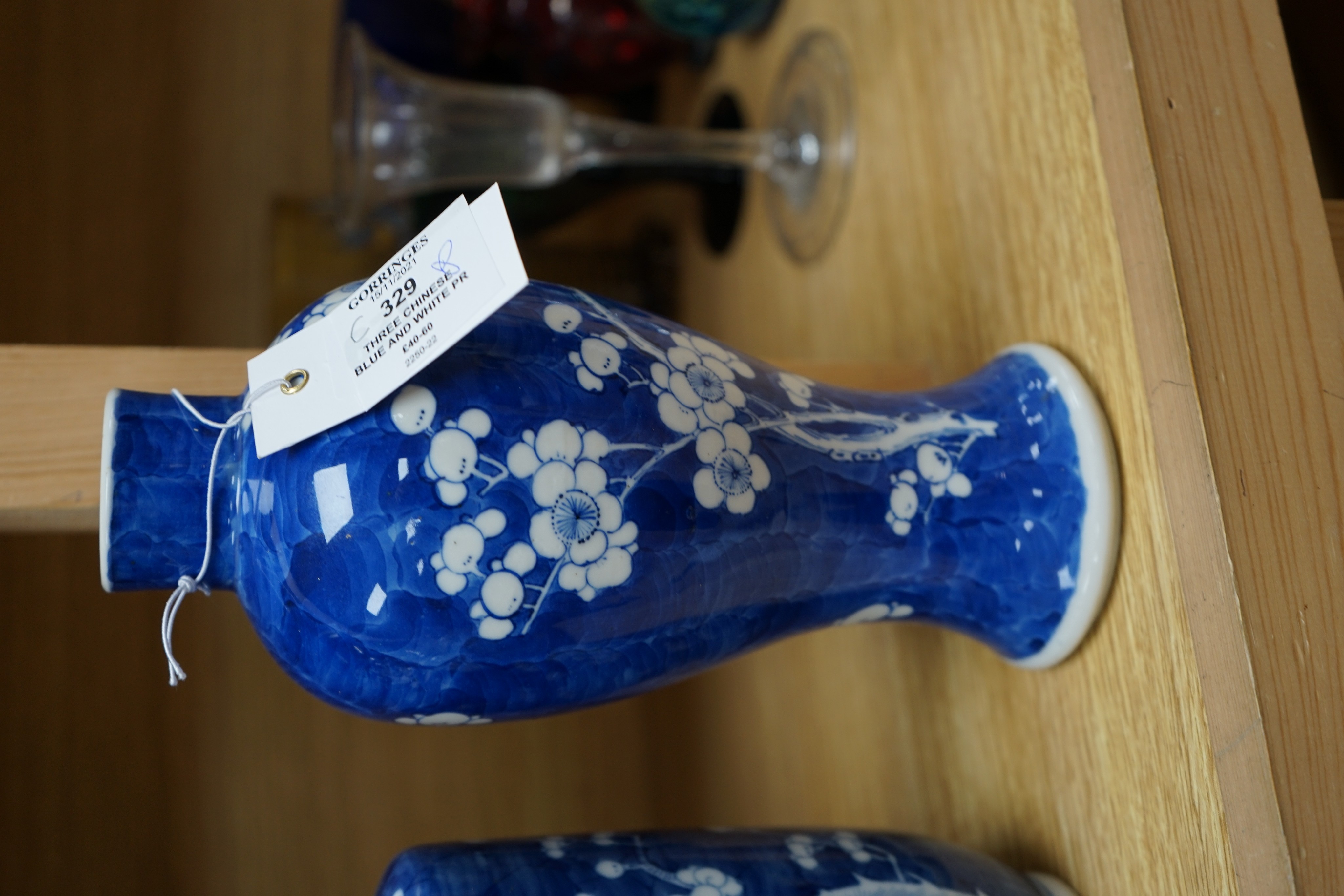 Three Chinese blue and white prunus vases. 25.5cm
